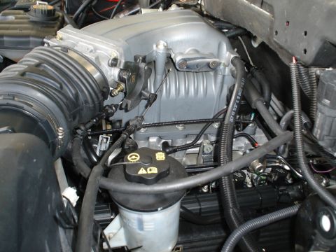 2007 Ford Mustang - Close-up view of an engine bay, focusing on the intake manifold and associated components.