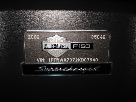 2007 Ford Mustang - This badge indicates a 2002 Harley-Davidson F-150 with a VIN and 'Supercharged' designation.