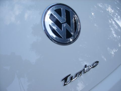 2003 Volkswagen Beetle - The Volkswagen emblem and 'Turbo' script are visible on the car's exterior.