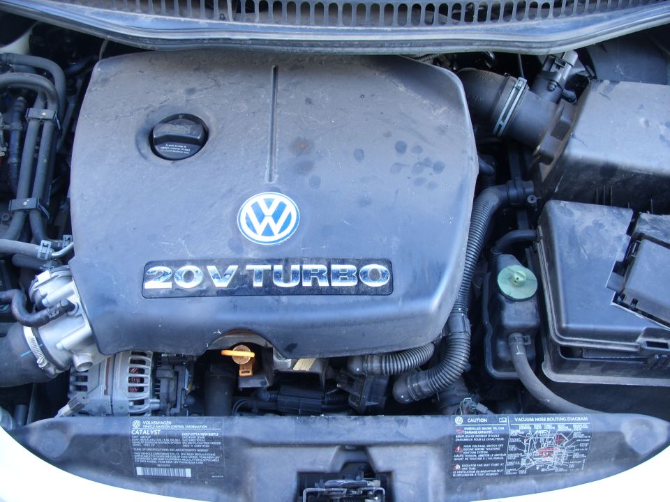 VW Beetle engine bay with black 20V Turbo engine cover and VW badge