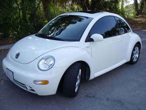 2003 Volkswagen Beetle - White 2003 Volkswagen Beetle with sunroof and tinted windows.