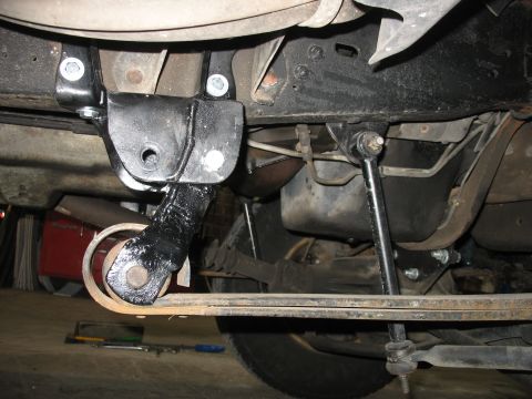 1995 Ford C-350 (Centurion Conversions) - Custom suspension part installation on a vehicle's undercarriage.