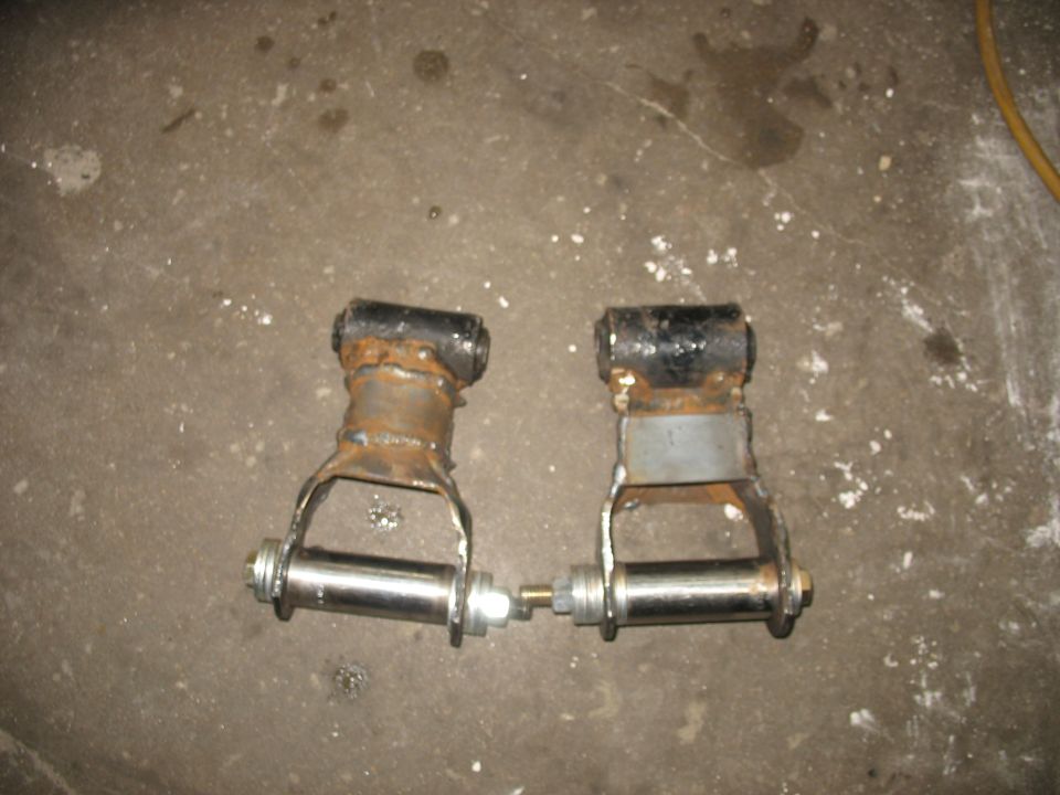 Pair of custom leaf spring shackles with metal bushings and bolts