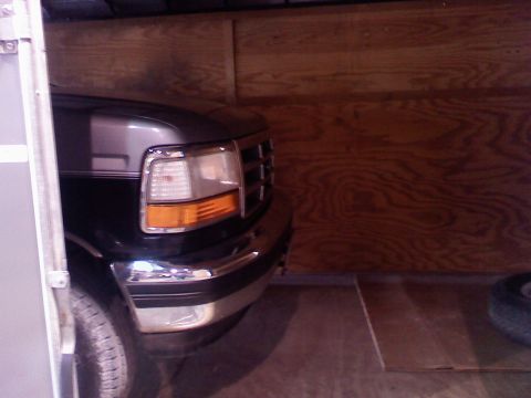 1995 Ford C-350 (Centurion Conversions) - Front view of an early 1990s Ford F-Series truck, possibly a 1992 model, parked indoors.