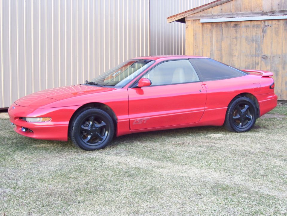 Red 1996 Ford Probe coupe, 3q front view