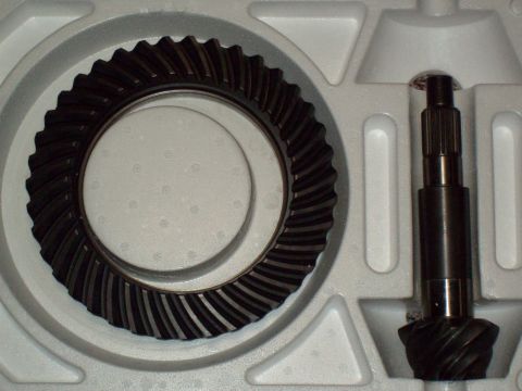 1989 Ford F-150 - Close-up of differential gears, a ring gear and pinion shaft, presented in protective packaging.