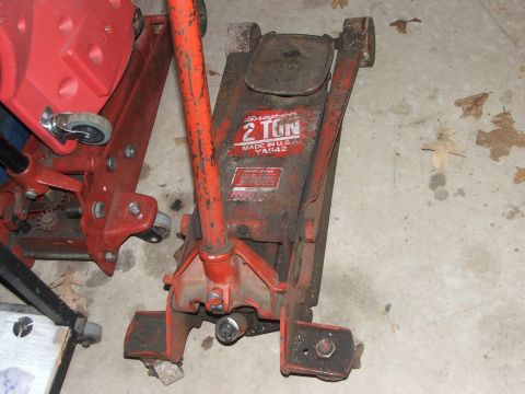 1965 Ford Mustang - A red Snap-on 2 Ton floor jack is shown, with the model number YA642 clearly visible on its side.
