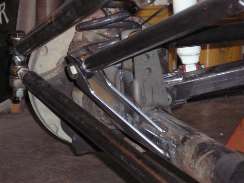 1991 Ford Bronco - Custom suspension linkage with adjustable rod ends and coil spring visible.