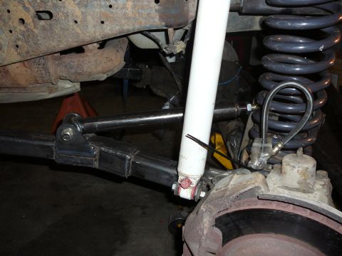 1991 Ford Bronco - Custom suspension components are visible on a vehicle, likely undergoing modification.