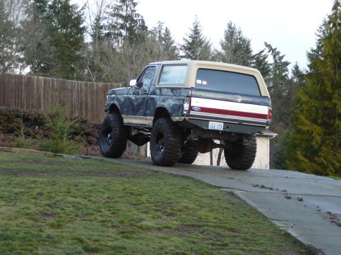 1991 Ford Bronco - This lifted Ford Bronco has a two-tone paint scheme and large off-road tires.