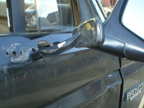 1983 Ford Bronco - Reinstall the gasket on the mirror and feed the wiring harness & support arm through the hole. The original nut plate can be cut so the nut…