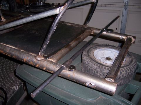 1991 Ford Bronco - A metal frame, possibly part of a custom build, is shown with a small tire.