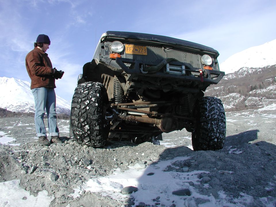 Modified truck with large tires and winch, front view. License plate FFZ 273