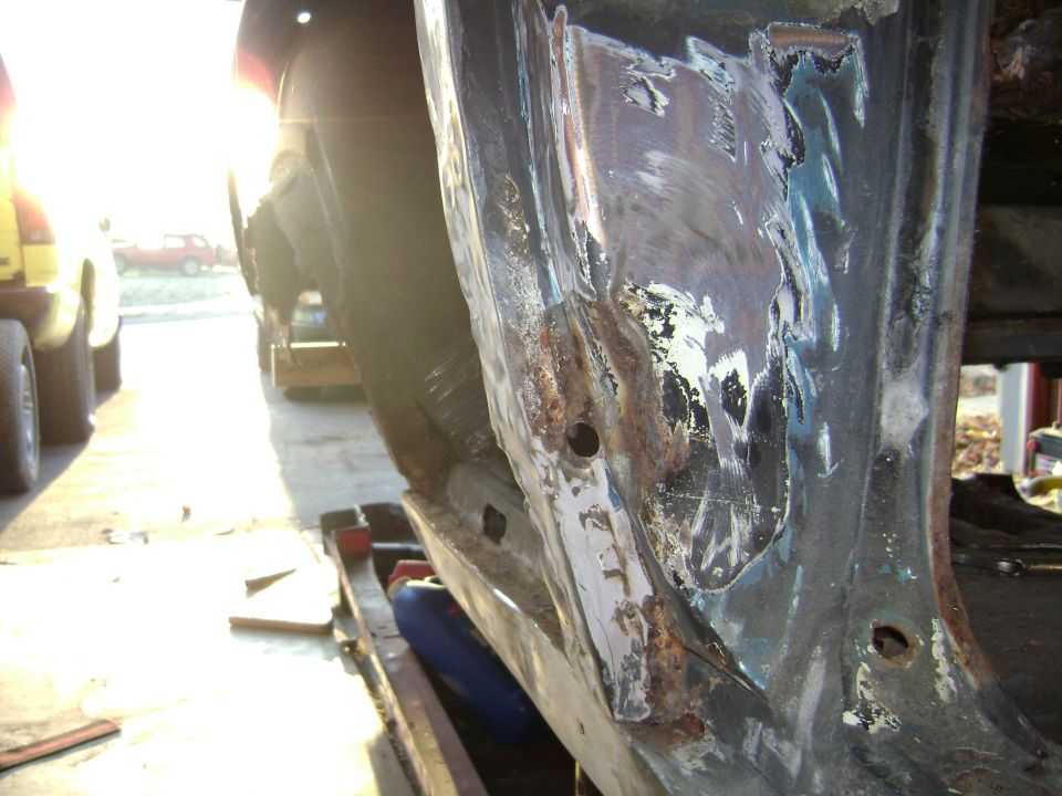 the right door jam has been shot looks like a 45 hole 
it passed threw the inner wheelwell probably got the tire        Humpf interesting ..If cars could talk...
