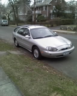 1997 Mercury Sable station wagon parked curbside, front quarter view
