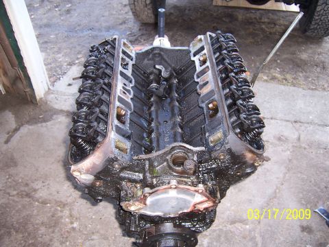1990 Ford Bronco - This image shows an engine block with its valve covers removed, revealing the internal mechanics.