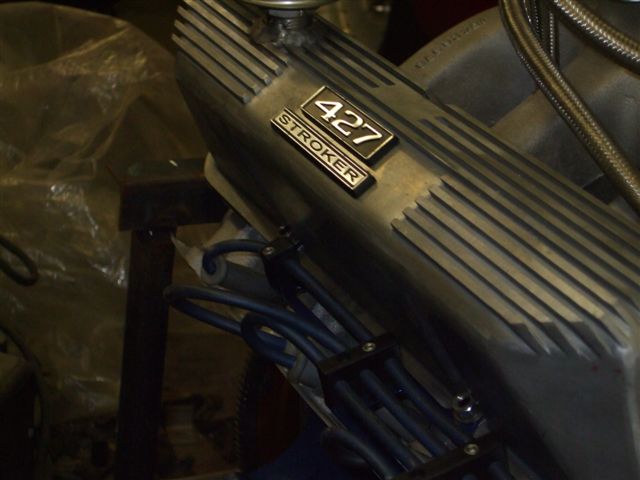 Engine valve cover with '427 STROKER' badge and ribbed detail