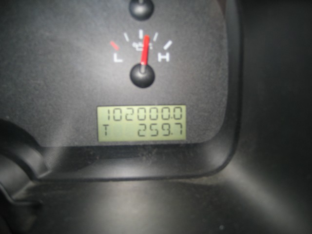Instrument cluster LCD reading 102000 miles with trip 259.7 below a temperature gauge