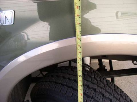 2000 Ford Excursion - front end after V code springs 42 1/2 inches to top of tan molding