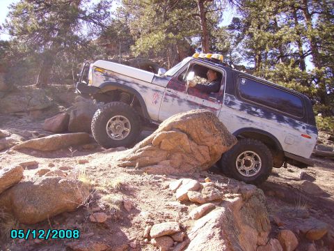1978 Ford Bronco - This 1978 Ford Bronco is shown off-roading over a rocky obstacle.