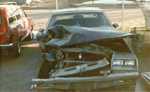 1978 Ford Bronco - Frontal collision damage to a car, with another vehicle partially visible on the left.
