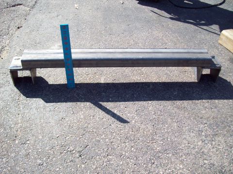 1989 Ford F-150 - A metal bracket is shown with a ruler for size reference.