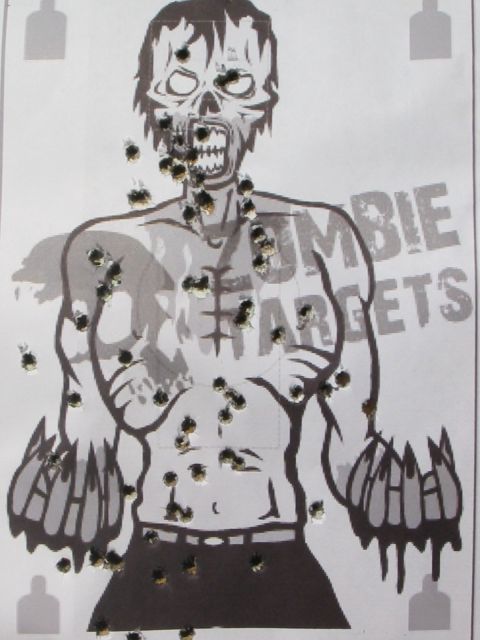 1996 Ford Bronco - A target with bullet holes is shown, depicting a zombie figure with the words "ZOMBIE TARGETS" visible.