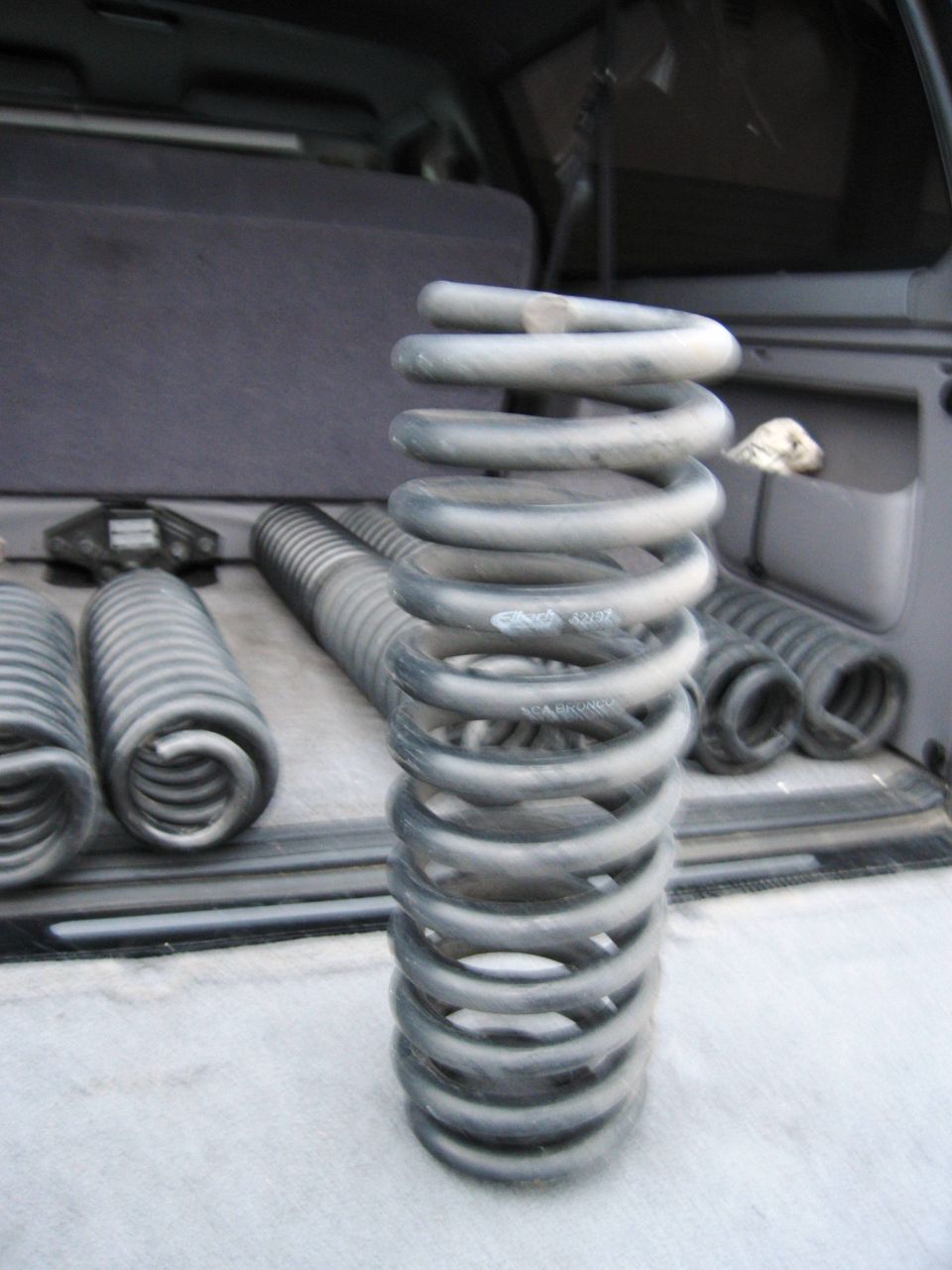 Coil springs in the cargo area of an SUV.