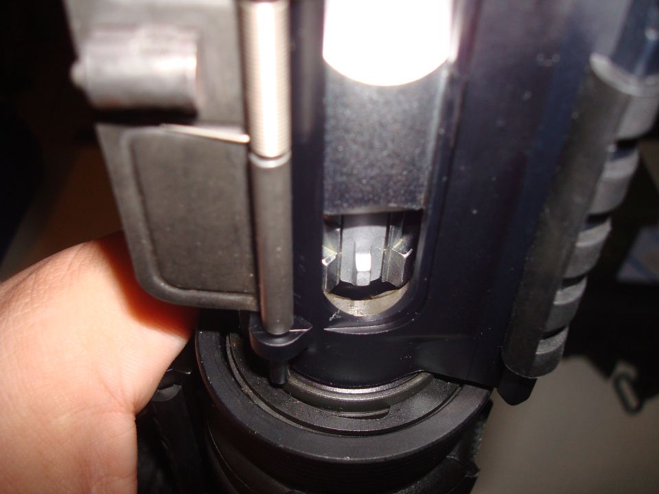 Close-up of AR-15 bolt carrier group and charging handle.