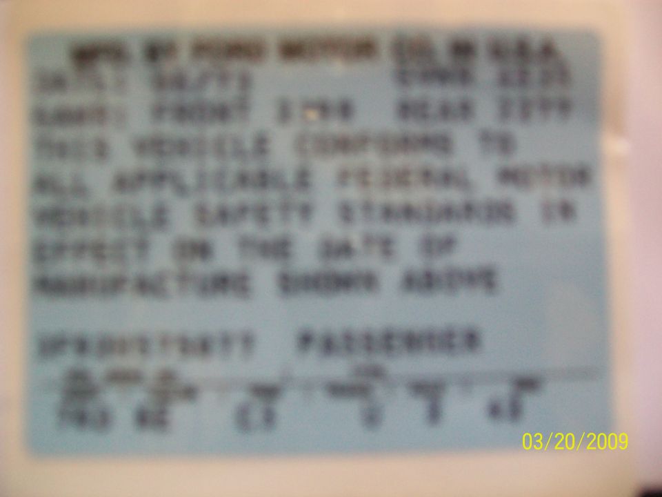 Ford Motor Co. passenger car certification label with GAWR and federal safety standards statement