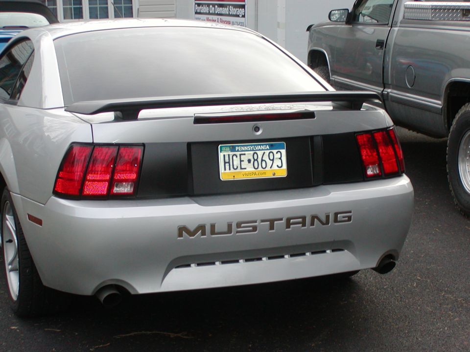 Silver Ford Mustang rear view with black spoiler and Pennsylvania license plate