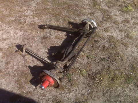 1990 Ford Bronco - Various vehicle suspension and chassis parts are visible, suggesting a repair or modification process.