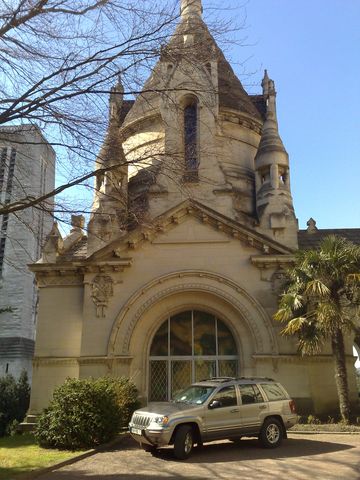 1991 Ford LTD Crown Victoria - Photograph of a chapel and Jeep, not a technical document.