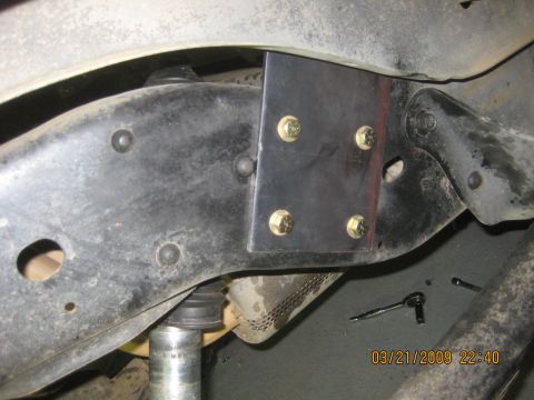 1909 Ford Bronco - A custom bracket is attached to the vehicle's chassis, likely for modification or repair.