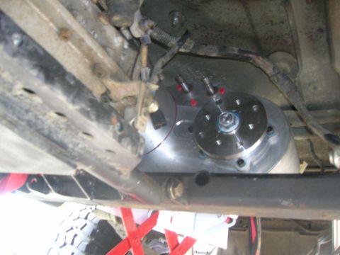 1996 Ford Bronco - Close-up view of the underside of a vehicle, showing mechanical components and suspension elements.