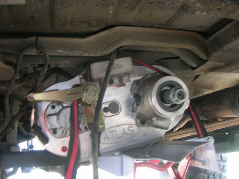 1996 Ford Bronco - Close-up view of an Atlas 4-speed transfer case, a component visible from the underside of a vehicle.