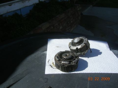 1985 Ford Bronco - Two metal automotive parts are shown on a paper towel, with a date stamp of 03.22.2009.