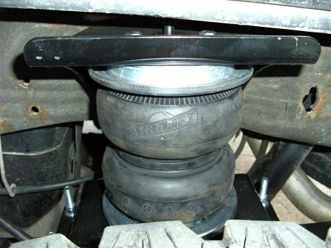 2005 Ford F-250 - This is a close-up view of an Air Lift air spring, a component of the vehicle's suspension system.