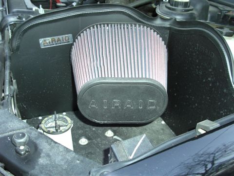 2005 Ford F-250 - Close-up of an AIRAID engine air intake system, showing the filter and housing.