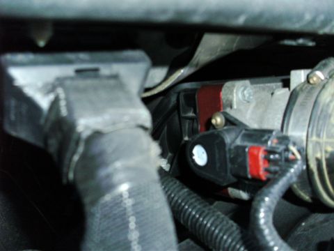 2005 Ford F-250 - Engine sensor and wiring detail, likely part of an intake system.
