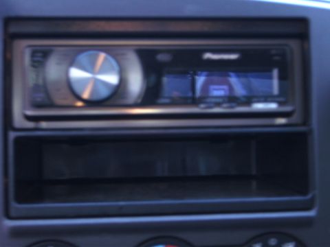 2005 Ford F-250 - Pioneer car stereo unit with an empty compartment beneath it.