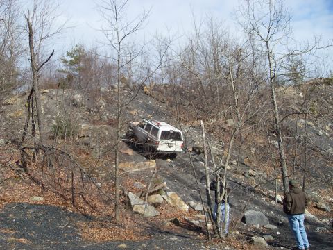 1987 Ford Bronco - Off-roading in a 1987 Ford Bronco on a challenging rocky terrain.