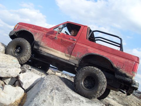 1987 Ford Bronco - This 1987 Ford Bronco is navigating a challenging rocky terrain.