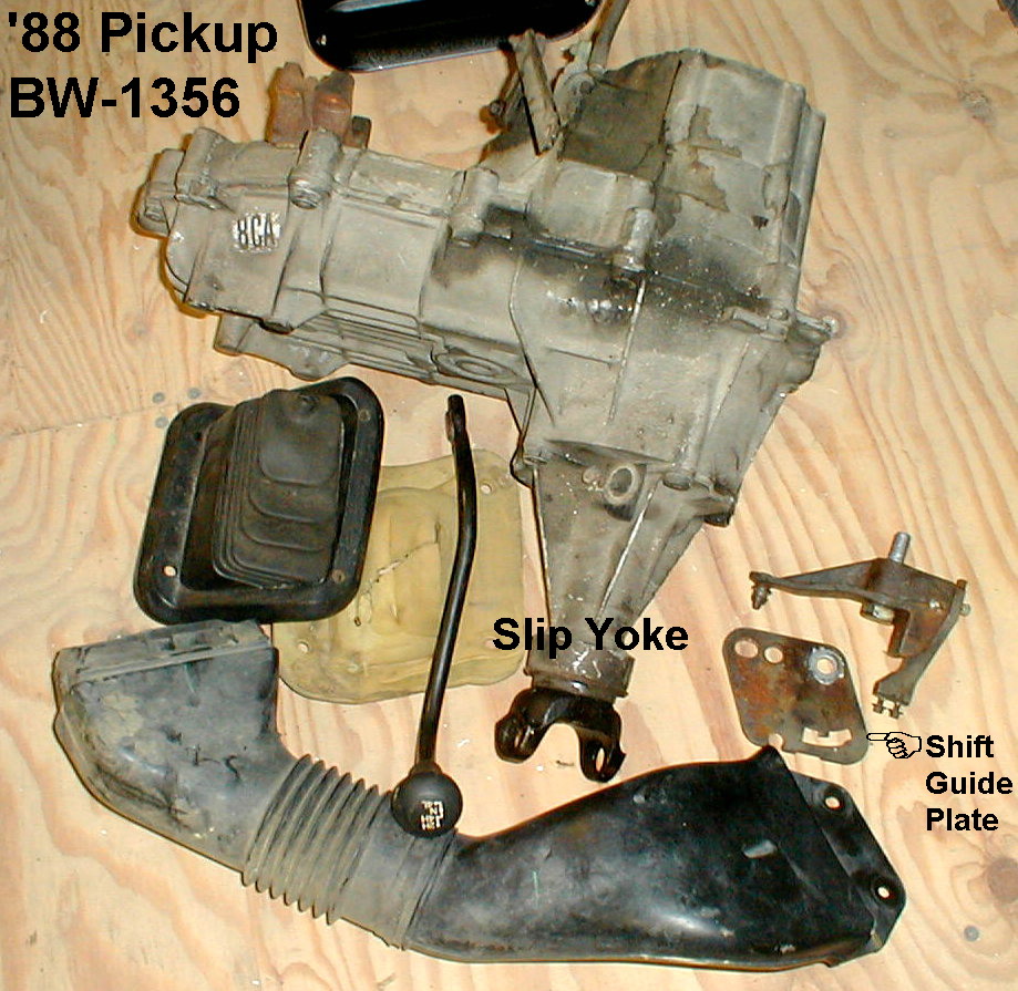 BW-1356 transfer case with shift boot, slip yoke, shift lever and guide plate laid out, labeled '88 Pickup