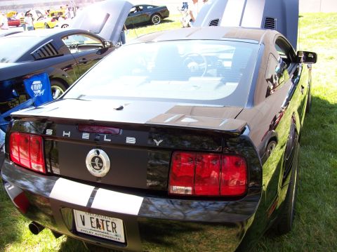 2007 Ford Mustang - The rear view of a black 2007 Ford Mustang Shelby GT500 shows its iconic taillights, "SHELBY" badging, and a Georgia license plate reading…