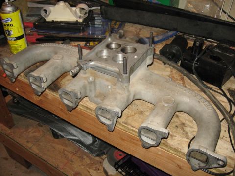 1981 Ford Bronco - The intake with the heated spacer. This particular spacer is designed to run coolant underneath the carb to prevent it from icing, especial…