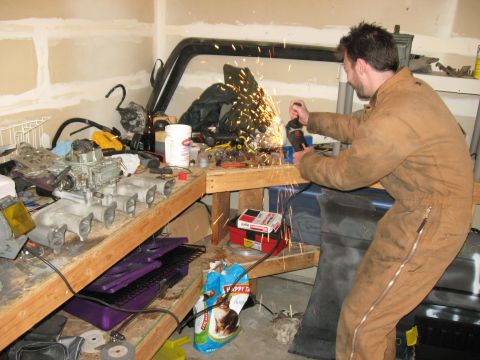1981 Ford Bronco - My brother working the grinder while we made a new accelerator bracket.