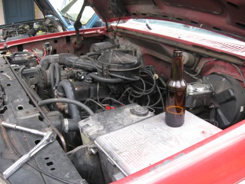 1981 Ford Bronco - Another shot of the stock engine bay with a view of the engine working necessities. My brother makes his own beer and brought some over for…