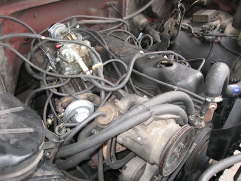 1981 Ford Bronco - Air filter removed with the stock carb visible.