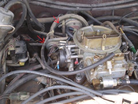 1982 Ford Bronco - Engine bay detail a Holley carburetor and vacuum lines, with red arrows indicating specific components.